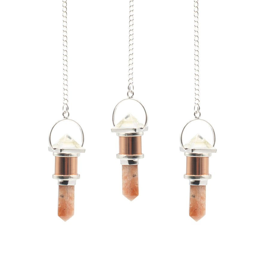 Pendule La Chambre lunaire — Cuivre · Cristal de roche & pierre de soleil